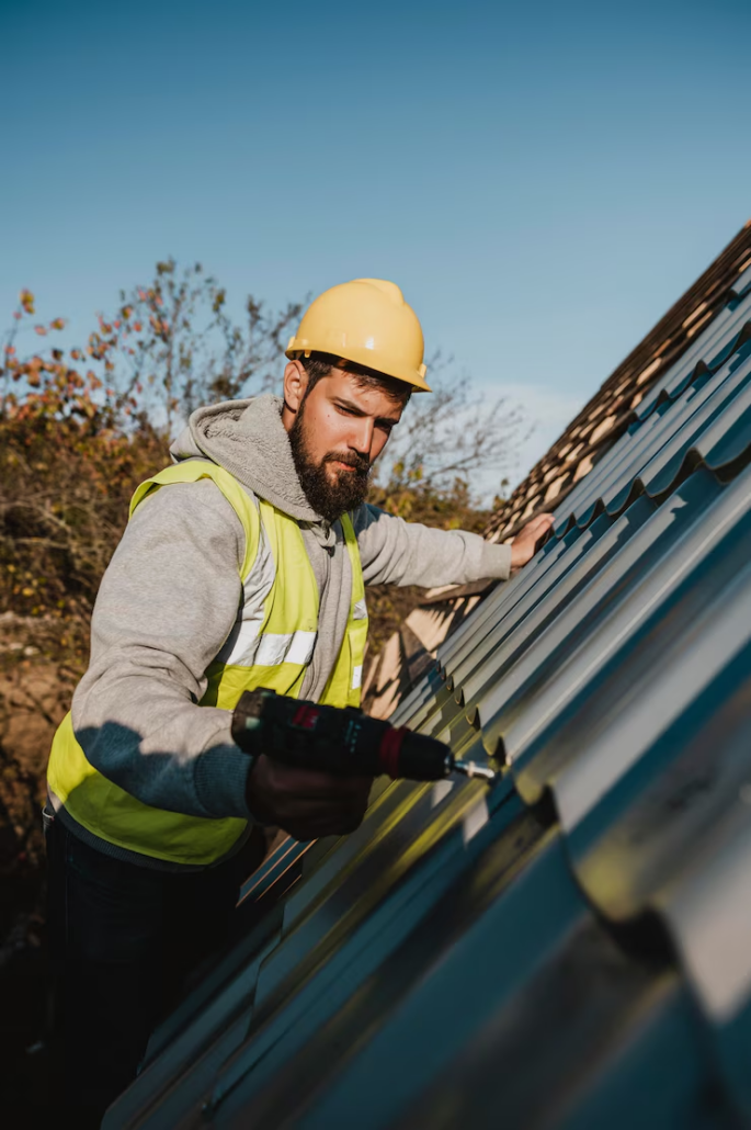 An expert precisely installing a new roof on a residential building. Get an estimate today by contacting us.