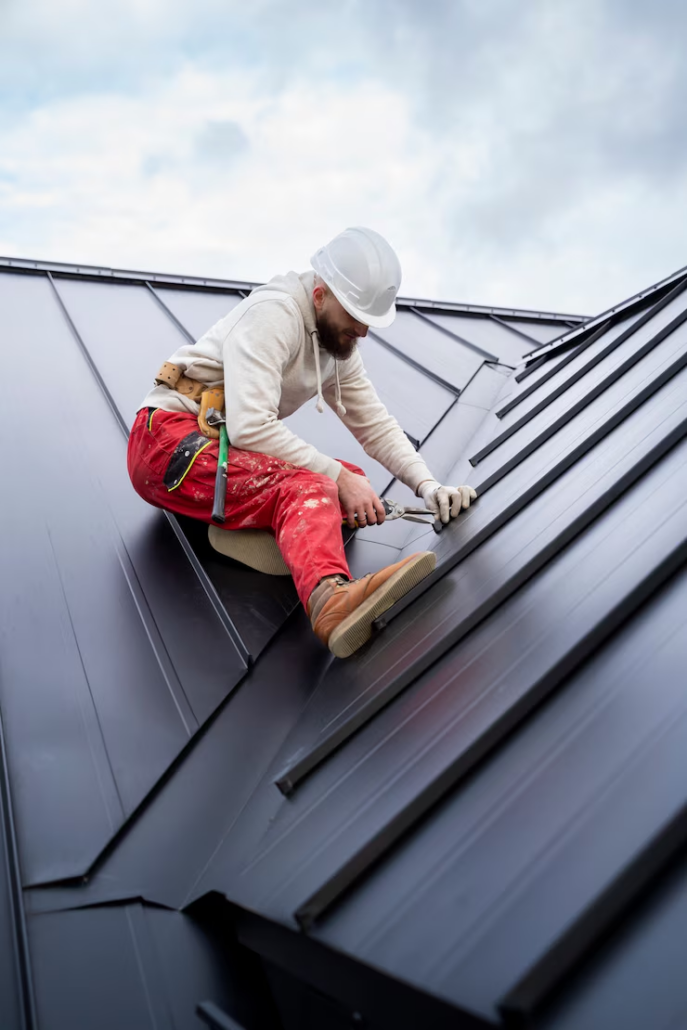An experienced roofer working on the installation of a roof. Get an estimate today by contacting us.
