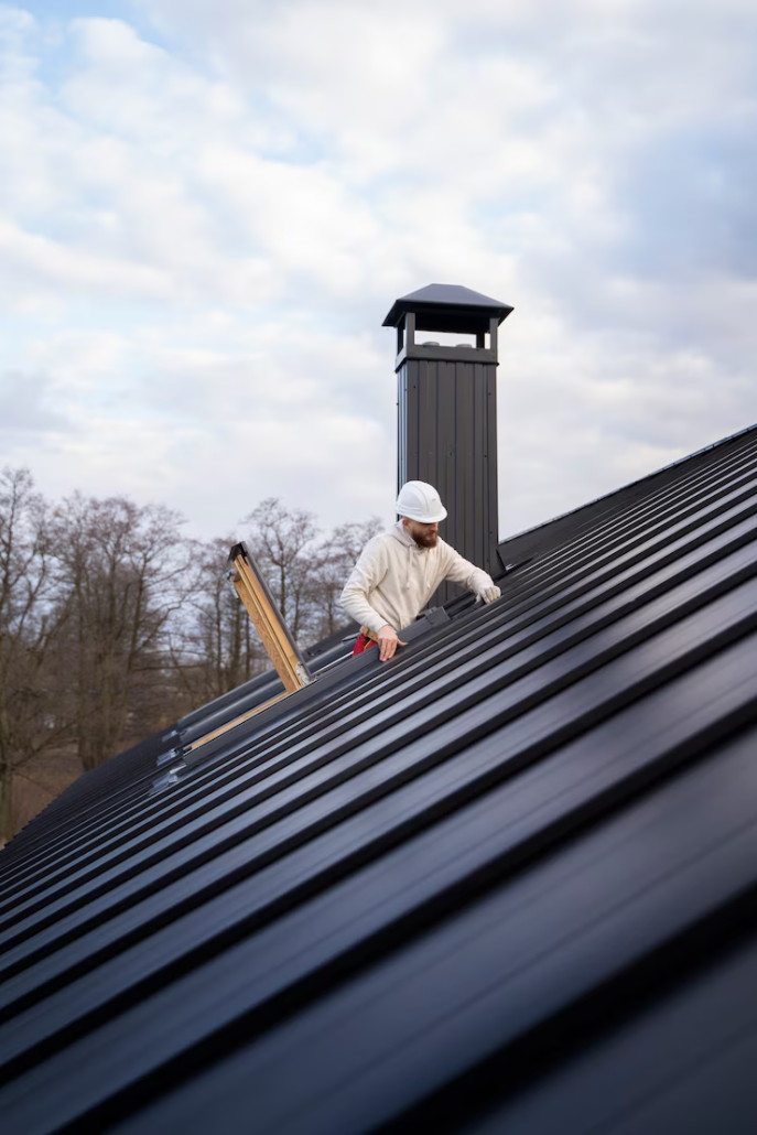 An expert working on the installation of a roof at a residential building. Get in touch with us today for a free estimate.