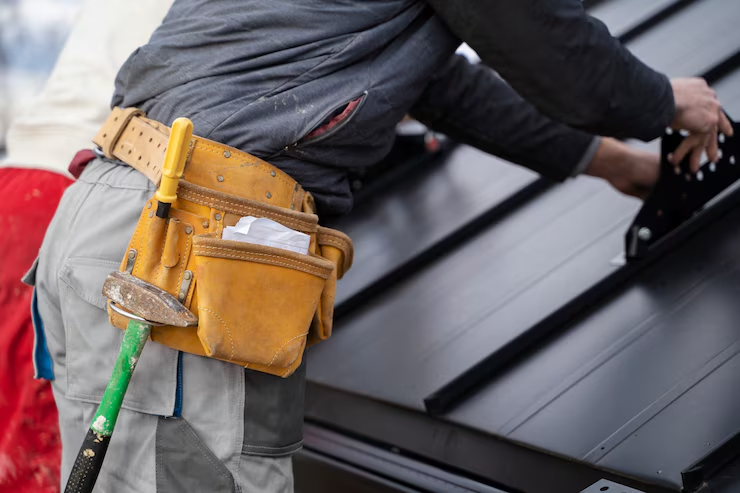 A professional working on a rooftop with accuracy and precision. To get an estimate, get in touch with us today.