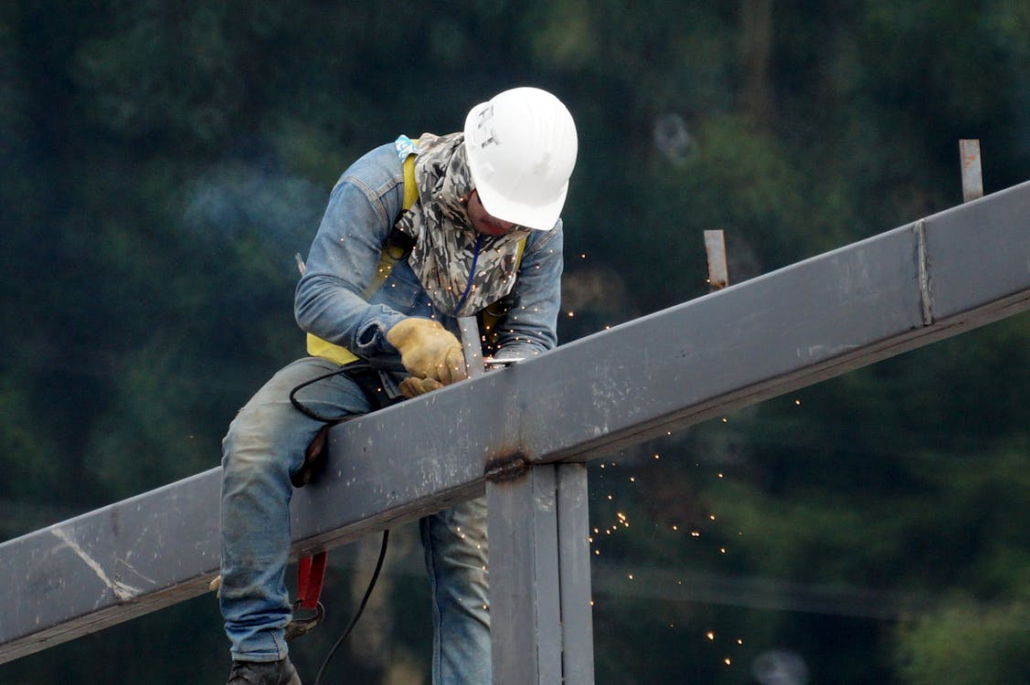A roofing contractor working on the framework of a roof. Get your free estimate today.