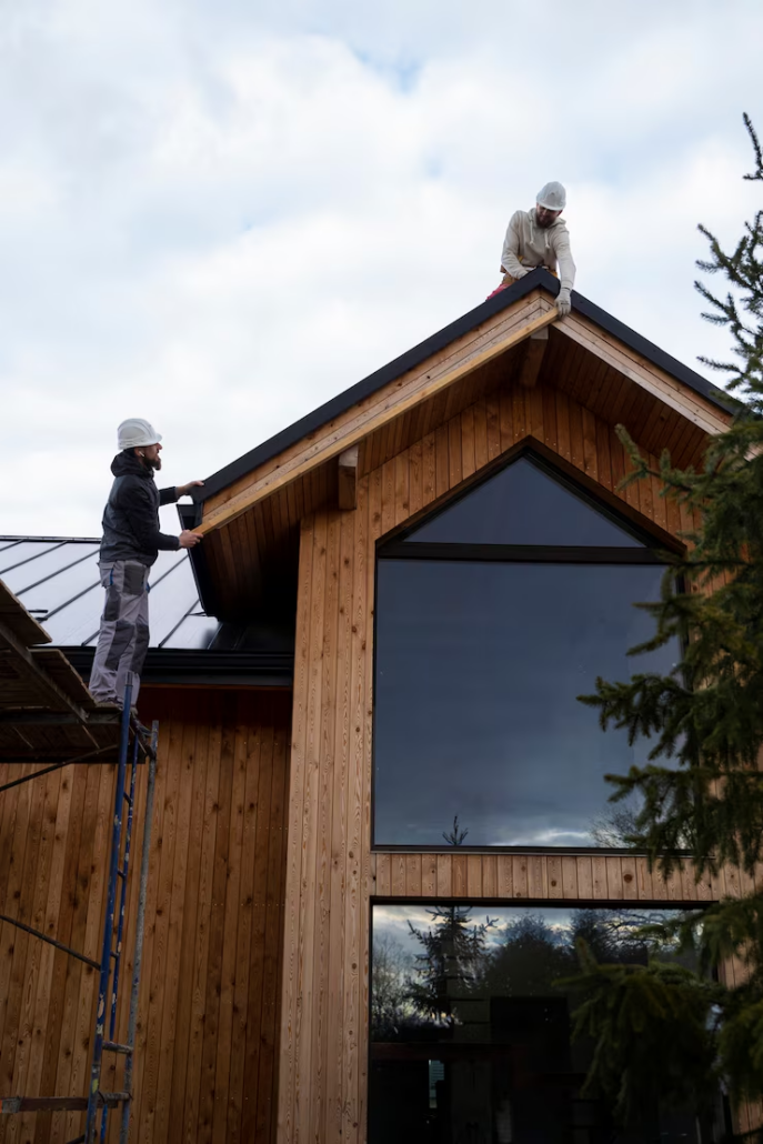 Skilled roofers working on the installation of a roof. Get a free estimate today by contacting us.