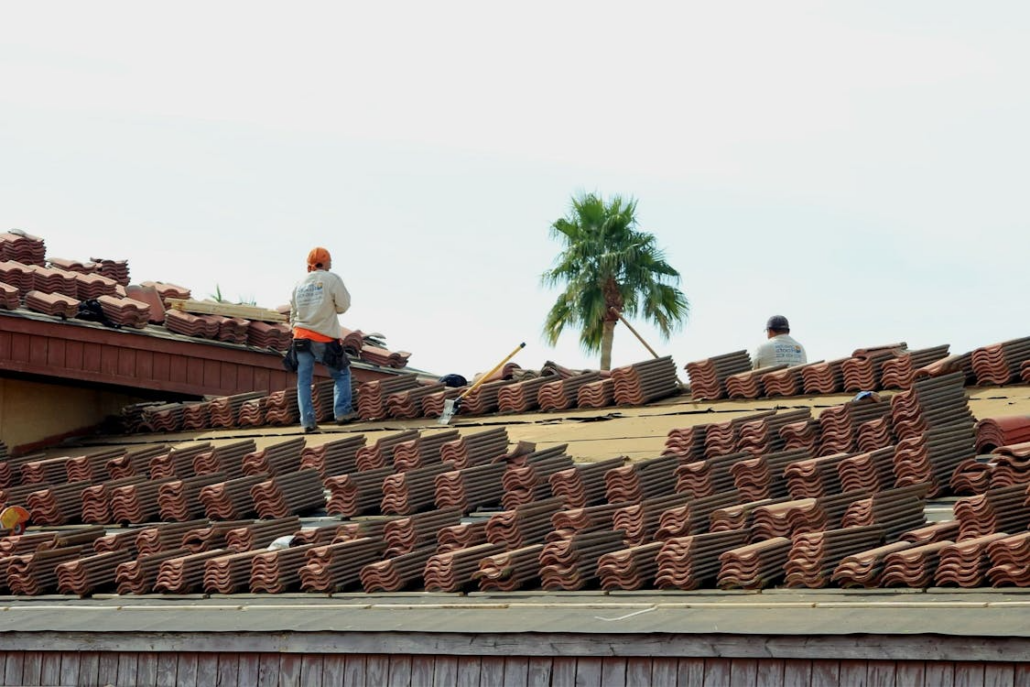 Certified roofing experts installing a roof with precision and care. Receive your free estimate from us today.