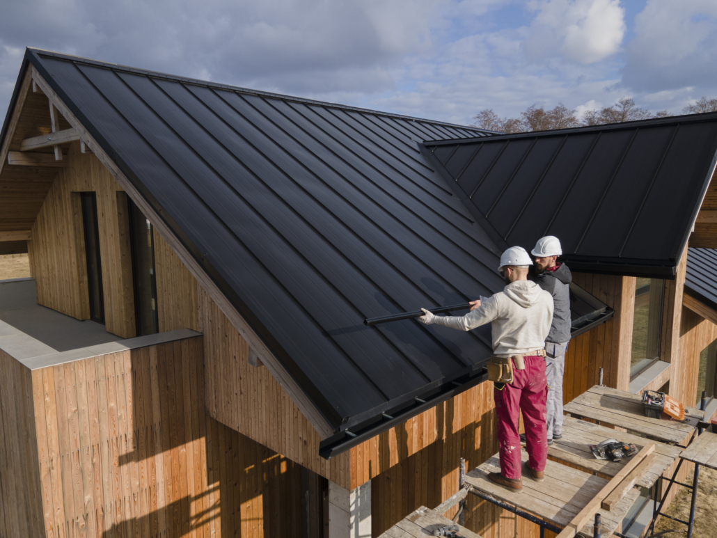 A licensed roofer repairing a rooftop with focus and precision. Get your free estimate today.