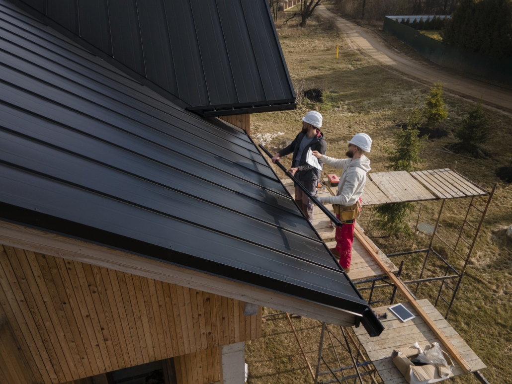 A licensed roofing contractor working on the repair of a residential rooftop. To get an estimate, get in touch with us today.