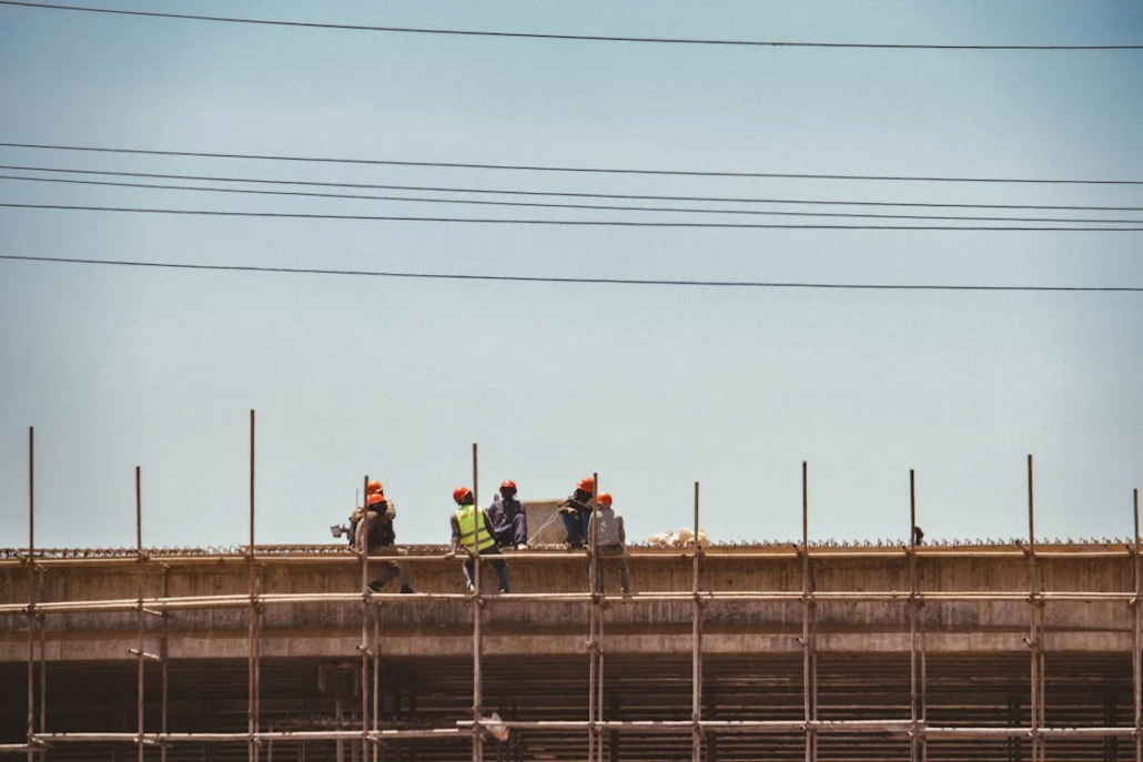 Licensed and certified roofers working on the construction of a roof. Get your free estimate today.