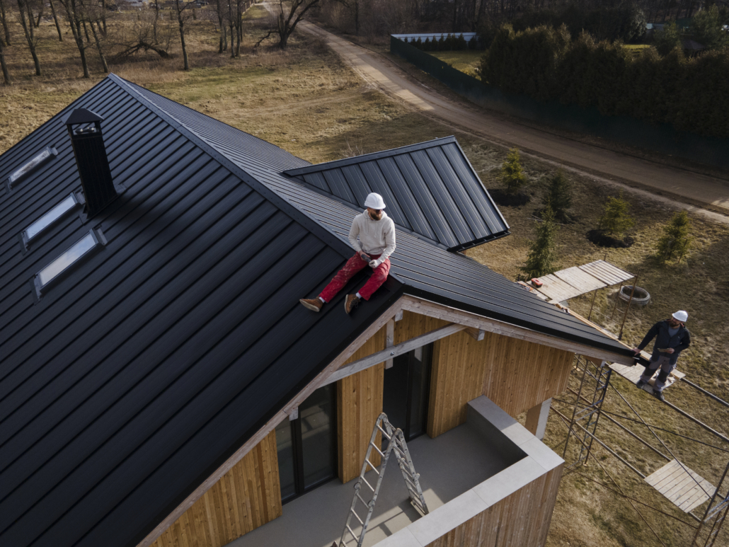 An expert roofer working on the repair of a roof. Get your free estimate today.