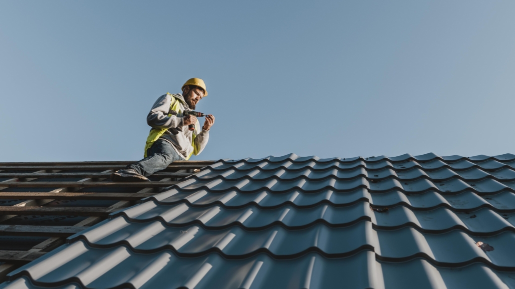 An expert roofer working on the installation of a new roof. Get in touch today for a free estimate.