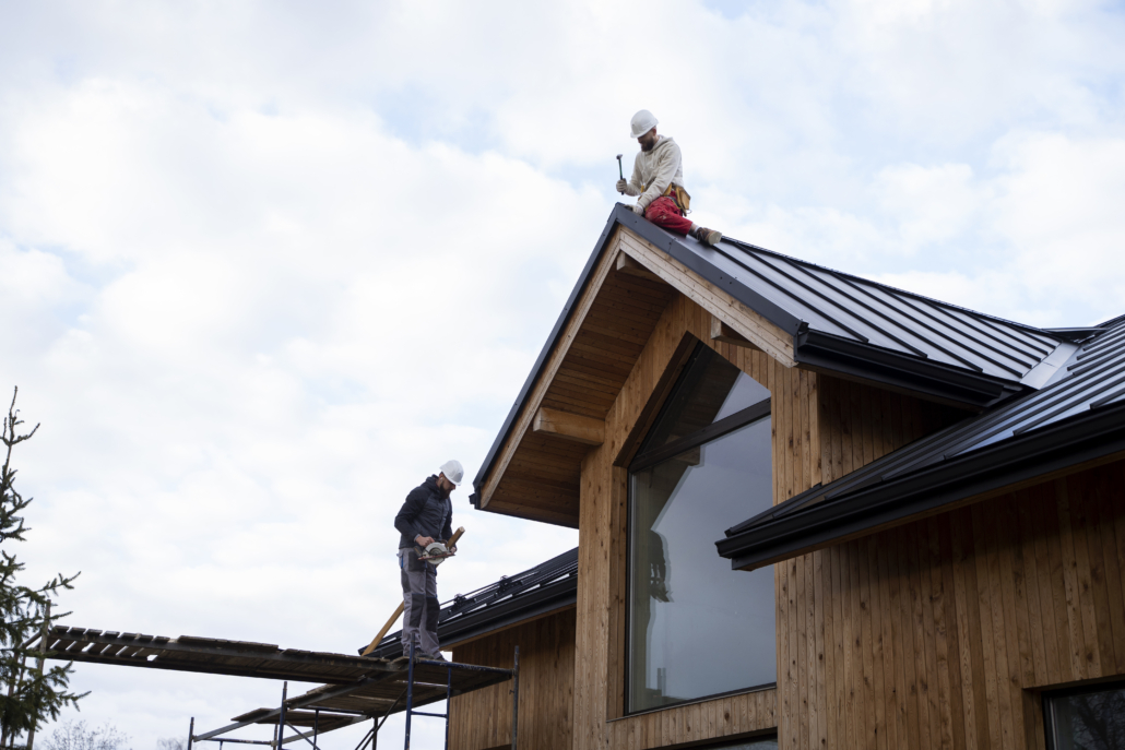 An experienced and licensed roofer working on the installation of a roof. Reach out to us today to get your free estimate.
