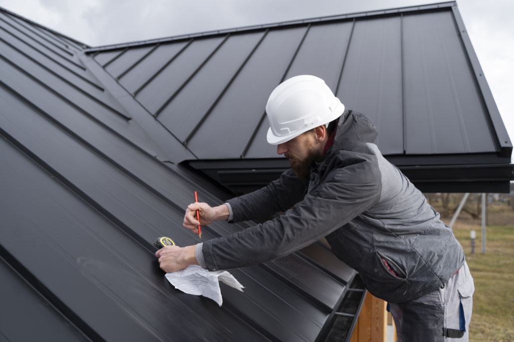 Licensed roofer working on the repair of a commercial establishment. Get your free estimate today.