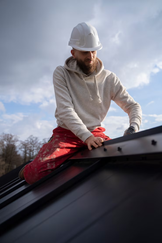 A licensed roofer repairing a rooftop with focus and precision. Get your free estimate today.